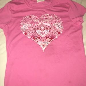 a girls pink shirt with rhinestones